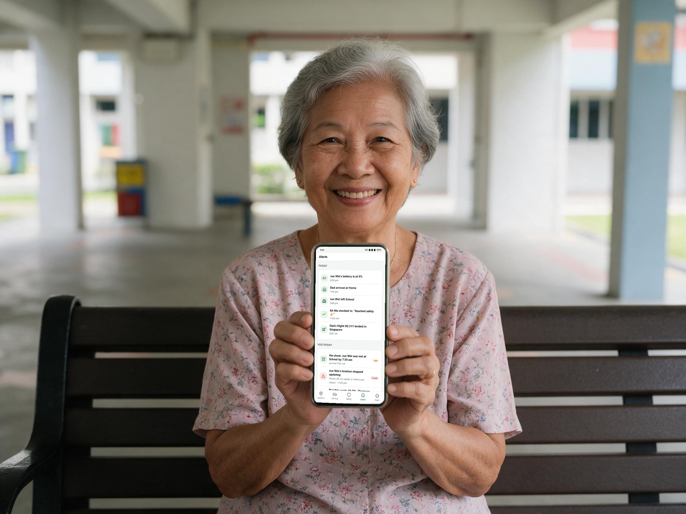 A grandmother showing Arrivo alerts on her phone